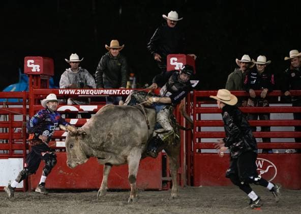 (250517) -- SURREY, May 17, 2025 -- A rider competes in the bull riding competition at the Cloverdale Rodeo and Country Fair in Surrey, British Columbia, Canada, May 16, 2025. As one of the largest rodeos in Canada, the annual Cloverdale Rodeo and Country Fair kicked off here on Friday. (Photo by Xinhua) (SP)CANADA-SURREY-CLOVERDALE RODEO LiangxSen 