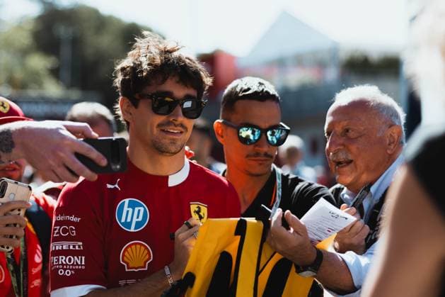 May 18, 2025, Imola, Bologna, Italy: CHARLES LECLERC (Ferrari) entering the paddock and signing fans t-shirts on race day (Sunday) at the Emilia-Romgna Grand Prix 2025. Imola Italy - ZUMAr193 20250518_zsp_r193_010 Copyright: xSaraxRuffonix