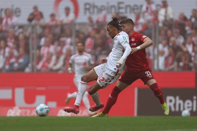 Damion Downs 1 FC Koeln and Jan Elvedi 1 FC Kaiserslautern battle for the ball during the 2 Bundesliga match between 1 FC Köln and 1 FC Kaiserslautern at RheinEnergieStadion on May 18, 2025 in Cologne, Germany, Germany Photo by Oliver Kaelke DeFodi Images Damion Downs 1 FC Koeln and Jan Elvedi 1 FC Kaiserslautern battle for the ball during the 2 Bundesliga match between 1 FC Köln and 1 FC Kaiserslautern at RheinEnergieStadion on May 18, 2025 in Cologne, Germany Photo by Oliver Kaelke DeFodi Images DFB DFL REGULATIONS PROHIBIT ANY USE OF PHOTOGRAPHS AS IMAGE SEQUENCES AND OR QUASI VIDEO Photo by Oliver Kaelke DeFodi Images