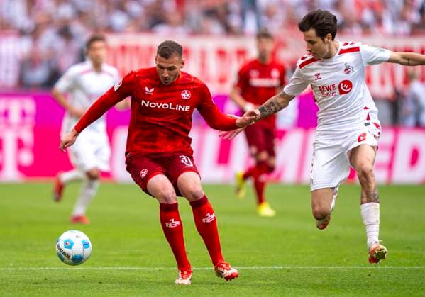 Duel between Luca Sirch 1 FC Kaiserslautern, 31 and Denis Huseinbasic 1 FC Koeln, 8 18 05 2025, 1 FC Köln 1 FC Kaiserslautern Football, 2 Bundesliga, RheinEnergieStadion Köln DFL regulations prohibit any use of photographs as image sequences and or quasi video Copyright: HMBxMedia xMarcoxBader