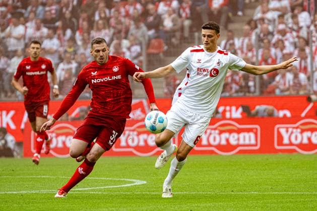 18 05 2025, Soccer 2 Bundesliga, Season 2024 2025, Matchday 34, 1 FC Koeln 1 FC Kaiserslautern at RheinEnergieStadion in Koeln duel between Luca Sirch 1 FC Kaiserslautern, 31 and Eric Martel 1 FC Koeln, 06 Important note In accordance with the regulations of the DFL German Football League and the DFB German Football Association, it is prohibited to utilize or have utilized photographs taken in the stadium or of the match in the form of sequential images or video-like photo series Foto Kirchner Media Thomas Haesler Copyright: xKirchner-Media ThomasxHaeslerx