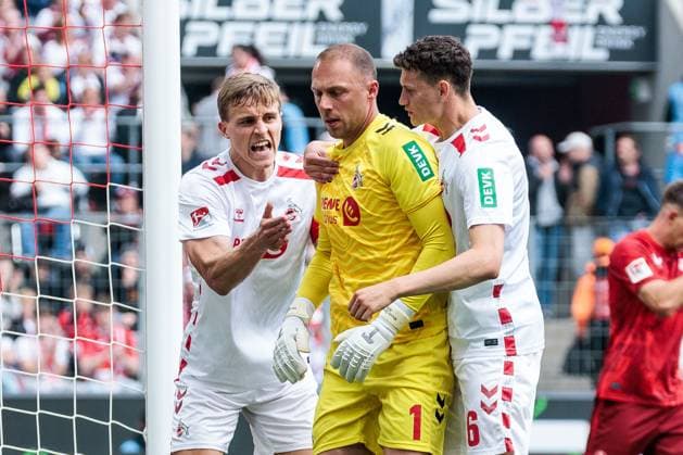 2 Soccer Bundesliga, 1 FC Köln 1 FC Kaiserslautern, 18 05 2025 Timo Hübers 1 FC Köln, 4 and Eric Martel 1 FC Köln, 6 hug Marvin Schwäbe 1 FC Köln, 1 after parade 2 Soccer Bundesliga, 1 FC Köln 1 FC Kaiserslautern, Cologne, RheinEnergiestadion on 18 05 2025 DFL REGULATIONS PROHIBIT ANY USE OF PHOTOGRAPHS AS IMAGE SEQUENCES AND OR QUASI VIDEO Copyright: xBEAUTIFULxSPORTS Wunderlx
