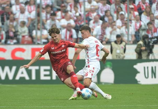 18 05 2025, xjpx, Soccer 2 Bundesliga, 1 FC Koeln 1 FC Kaiserslautern v l duel between Florian Kleinhansl Kaiserslautern and Eric Martel Koeln DFL DFB REGULATIONS PROHIBIT ANY USE OF PHOTOGRAPHS as IMAGE SEQUENCES and or QUASI VIDEO Koeln