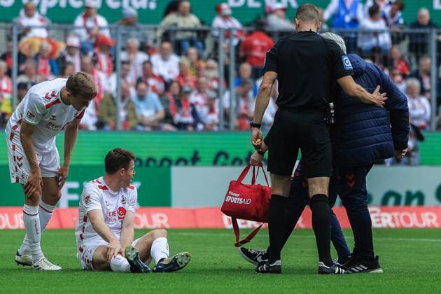Soccer 2 Bundesliga 34 Matchday 1 FC Köln 1 FC Kaiserslautern on 18 05 2025 at RheinEnergieStadion in Cologne Dominique Heintz Köln sits injured on the ground DFL regulations prohibit any use of photographs as image sequences and or quasi video xJRx