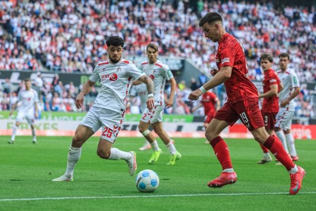 Soccer 2 Bundesliga 34 Matchday 1 FC Köln 1 FC Kaiserslautern on 18 05 2025 at RheinEnergieStadion in Cologne Jusuf Gazibegovic Köln , left Daniel Hanslik Kaiserslautern , right DFL regulations prohibit any use of photographs as image sequences and or quasi video xJRx