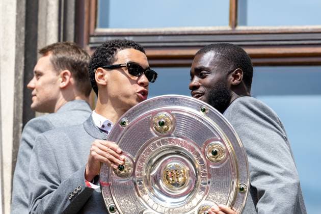 Jamal Musiala 42 FC Bayern Muenchen , Dayot Upamecano 2 FC Bayern Muenchen with the Meisterschale, Meisterfeier, Rathausbalkon, FC Bayern Muenchen und FC Bayern Frauen, Fussball, 18 05 2025 DFB regulations prohibit any use of photographs as image sequences and or quasi video Muenchen Bayern Germany Copyright: xkolbert-press UlrichxGamelx