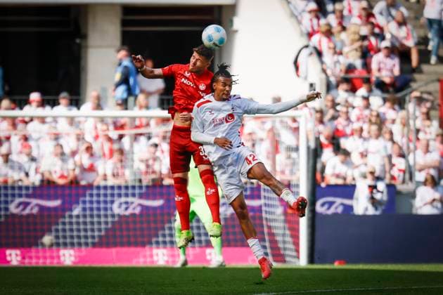 2 Soccer Bundesliga, 1 FC Köln 1 FC Kaiserslautern, 18 05 2025 Jan Elvedi 1 FC Kaiserslautern, 33 and Damion Downs 1 FC Köln, 42 during the header duel 34 matchday of 2 Soccer Bundesliga, 2 Soccer Bundesliga, 1 FC Köln 1 FC Kaiserslautern on 18 05 2025 at RheinEnergie Stadion in Cologne THE DFL REGULATIONS PROHIBIT ANY USE OF PHOTOS AS PICTURE SEQUENCES AND OR QUASI VIDEO Copyright: xBEAUTIFULxSPORTS AxelxKohringx