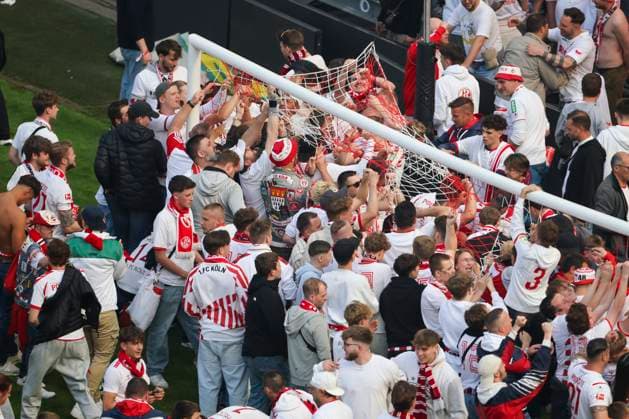 Soccer 2 Bundesliga, 1 FC Köln 1 FC Kaiserslautern, Matchday 34, RheinEnergieStadion Fans of 1 FC Köln cut off parts of the goal net after the final whistle