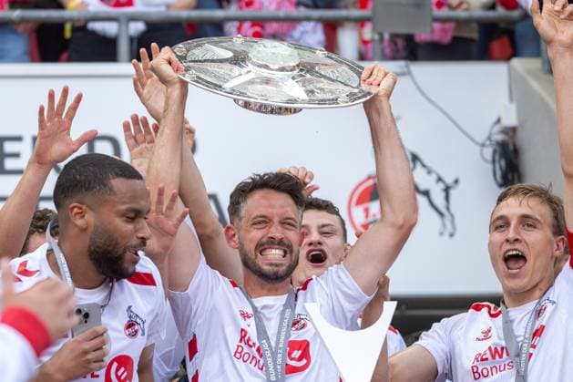 18 05 2025, Soccer 2 Bundesliga, Season 2024 2025, 34 Matchday, 1 FC Koeln 1 FC Kaiserslautern at RheinEnergieStadion in Koeln Mark Uth 1 FC Koeln, 13 with the championship trophy Important note According to the regulations of the DFL German Football League and the DFB German Football Association, it is prohibited to use or have used photographs taken in the stadium and or of the match in the form of sequential images and or video-like photo series Photo Kirchner Media Thomas Haesler Copyright: xKirchner-Media ThomasxHaeslerx
