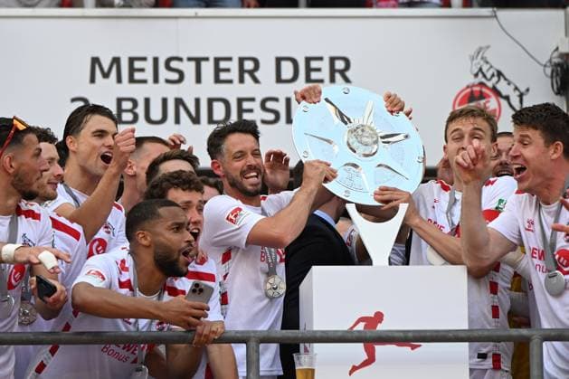 Mark Uth 1 FC Koeln and Timo Huebers 1 FC Koeln with the championship trophy of second Bundesliga during the 2 Bundesliga match between 1 FC Köln and 1 FC Kaiserslautern at RheinEnergieStadion on May 18, 2025 in Cologne, Germany Photo by Ralf Treese DeFodi Images Mark Uth 1 FC Koeln and Timo Huebers 1 FC Koeln the championship trophy of second Bundesliga during the 2 Bundesliga match between 1 FC Köln and 1 FC Kaiserslautern at RheinEnergieStadion on May 18, 2025 in Cologne, Germany Photo by Ralf Treese DeFodi Images DFB DFL REGULATIONS PROHIBIT ANY USE OF PHOTOGRAPHS AS IMAGE SEQUENCES AND OR QUASI VIDEO Photo by Ralf Treese DeFodi Images
