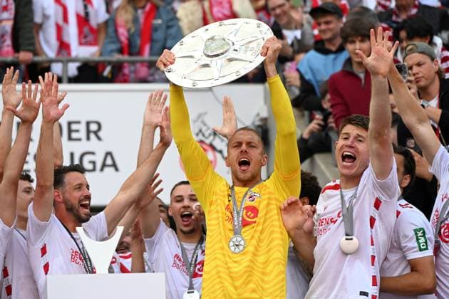 Goalkeeper Marvin Schwaebe 1 FC Koeln the championship trophy of second Bundesliga during the 2 Bundesliga match between 1 FC Köln and 1 FC Kaiserslautern at RheinEnergieStadion on May 18, 2025 in Cologne, Germany, Germany Photo by Ralf Treese DeFodi Images Goalkeeper Marvin Schwaebe 1 FC Koeln the championship trophy of second Bundesliga during the 2 Bundesliga match between 1 FC Köln and 1 FC Kaiserslautern at RheinEnergieStadion on May 18, 2025 in Cologne, Germany Photo by Ralf Treese DeFodi Images DFB DFL REGULATIONS PROHIBIT ANY USE OF PHOTOGRAPHS AS IMAGE SEQUENCES AND OR QUASI VIDEO Photo by Ralf Treese DeFodi Images