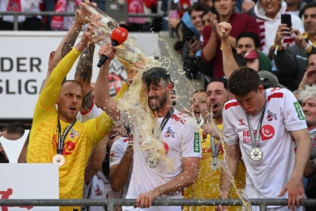 Goalkeeper Marvin Schwaebe 1 FC Koeln and Mark Uth 1 FC Koeln gets a beer shower during the 2 Bundesliga match between 1 FC Köln and 1 FC Kaiserslautern at RheinEnergieStadion on May 18, 2025 in Cologne, Germany, Germany Photo by Ralf Treese DeFodi Images Goalkeeper Marvin Schwaebe 1 FC Koeln and Mark Uth 1 FC Koeln gestures during the 2 Bundesliga match between 1 FC Köln and 1 FC Kaiserslautern at RheinEnergieStadion on May 18, 2025 in Cologne, Germany Photo by Ralf Treese DeFodi Images DFB DFL REGULATIONS PROHIBIT ANY USE OF PHOTOGRAPHS AS IMAGE SEQUENCES AND OR QUASI VIDEO Photo by Ralf Treese DeFodi Images