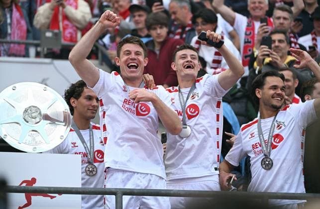 Football, Bundesliga, Germany, Men, Season 2024 2025, Matchday 34, Rhein Energie Stadion Köln, 1 FC Köln FC Kaiserslautern 4 0 Dominique Heintz KOE , Eric Martel KOE and Max Finkgräfe KOE cheer next to the championship trophy Cheers, joy, action