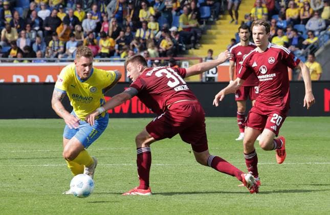 Sebastian Polter Eintracht Braunschweig , Robin Knoche 1 FC Nuernberg in duel Football, Men, Season 2024 2025 2 BL, Eintracht Stadion, Eintracht Braunschweig vs 1 FC Nuernberg, 1 4 Braunschweig must go into relegation DFL REGULATIONS PROHIBIT ANY USE OF PHOTOGRAPHS AS IMAGE SEQUENCES AND OR QUASI VIDEO