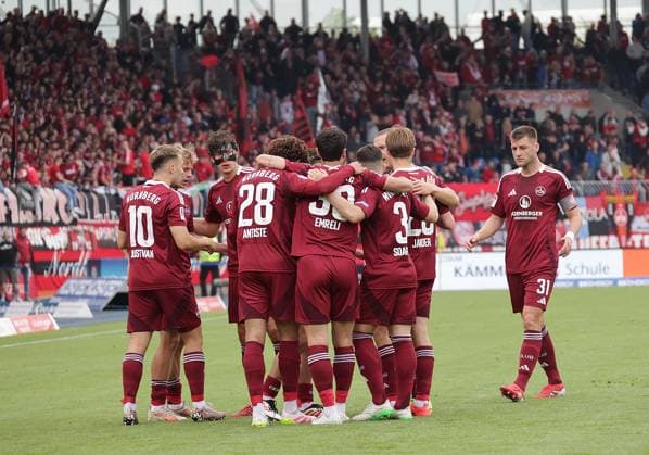 Robin Knoche 1 FC Nuernberg and his team celebrate the victory Football, Men, Season 2024 2025 2 BL, Eintracht Stadion, Eintracht Braunschweig vs 1 FC Nuernberg, 1 4 Braunschweig must go into relegation DFL REGULATIONS PROHIBIT ANY USE OF PHOTOGRAPHS AS IMAGE SEQUENCES AND OR QUASI VIDEO
