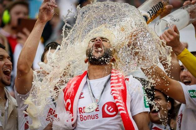 2 Soccer Bundesliga, 1 FC Köln 1 FC Kaiserslautern, 18 05 2025 Linton Maina 1 FC Köln, 37 gets a beer shower 34 Matchday of 2 Soccer Bundesliga, 2 Soccer Bundesliga, 1 FC Köln 1 FC Kaiserslautern on 18 05 2025 at RheinEnergie Stadion in Cologne THE DFL REGULATIONS PROHIBIT ANY USE OF PHOTOS AS PICTURE SEQUENCES AND OR QUASI VIDEO Copyright: xBEAUTIFULxSPORTS AxelxKohringx