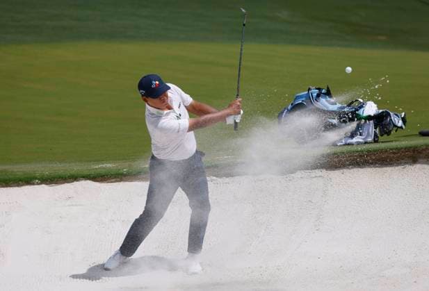 Si Woo Kim of South Korea hits out of a bunker on the 1st hole during the final round of the 2025 PGA, Golf Herren Championship at the Quail Hollow Golf Club in Charlotte, North Carolina on Sunday, May 18, 2025.  CHA20250518605 TANNENxMAURY
