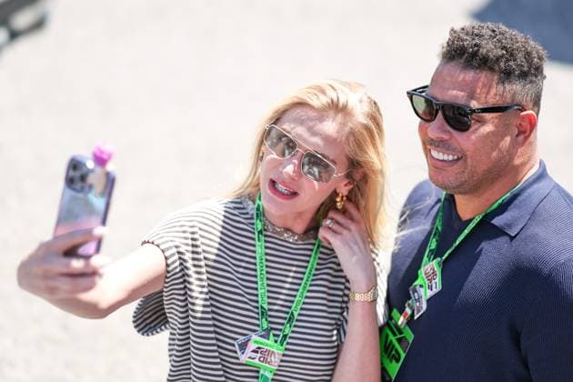(250519) -- IMOLA, May 19, 2025 -- Brazilian former football player Ronaldo poses with his wife before the Formula One Emilia Romagna Grand Prix at the Autodromo Internazionale Enzo e Dino Ferrari race track in Imola, Italy, May 18, 2025. (Photo by Xinhua) (SP)ITALY-IMOLA-AUTO-F1 GRAND PRIX QianxJun 