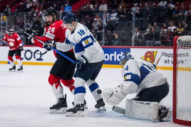 250519 Phillip Danault of Canada against Vili Saarijärvi and goaltender Juuse Saros of Finland during the 2025 IIHF Ice Hockey World Championship group stage game between Canada and Finland on May 19, 2025 in Stockholm Photo Simon Hastegard BILDBYRAN kod SH SH0623 ishockey ice hockey ishockey vm 2025 vm 2025 iihf world championship kanada canada finland 10 bbeng  Copyright: SIMONxHASTEGARD BB250519SH009