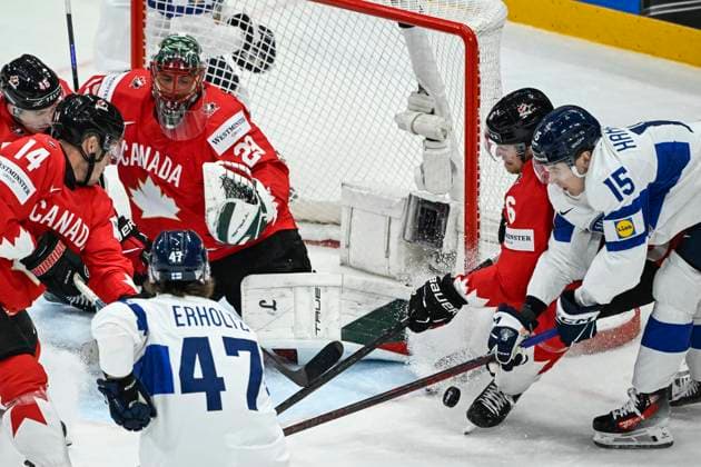 STOCKHOLM, SWEDEN 20250519 Canada s goalkeeper Marc Andre Fleury in action against Finland s Lenni Hameenaho 15 and Eemil Erholtz 47 during the IIHF Ice Hockey World Championship group A match between Canada and Finland at Avicii Arena in Stockholm, Sweden, on May 19, 2025 STOCKHOLM SWEDEN x10080x  Copyright: xFredrikxSandberg TTx ICE HOCKEY WC CANADA-FINLAND