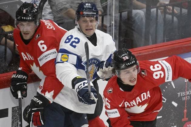 Harri Pesonen (C) of Finland vies with Travis Sanheim (L) and Macklin Celebrini of Canada during the 2025 IIHF Ice hockey, Eishockey World Championships preliminary round group A match between Canada and Finland in Stockholm on May 19, 2025. Stockholm Sweden LKFTJK20250519221845WKBO  Copyright: xVesaxMoilanenx LKFTJK20250519221845WKBO