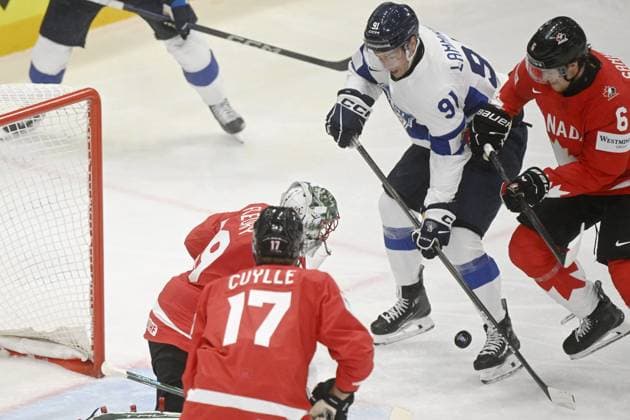 Juho Lammikko (2R) of Finland attempts to score against goalkeeper Marc-Andre Fleury of Canada while Will Cuylle (17) and Travis Sanheim (6) defend during the 2025 IIHF Ice hockey, Eishockey World Championships preliminary round group A match between Canada and Finland in Stockholm on May 19, 2025. Stockholm Sweden LKFTJK20250519222611GNPU  Copyright: xVesaxMoilanenx LKFTJK20250519222611GNPU