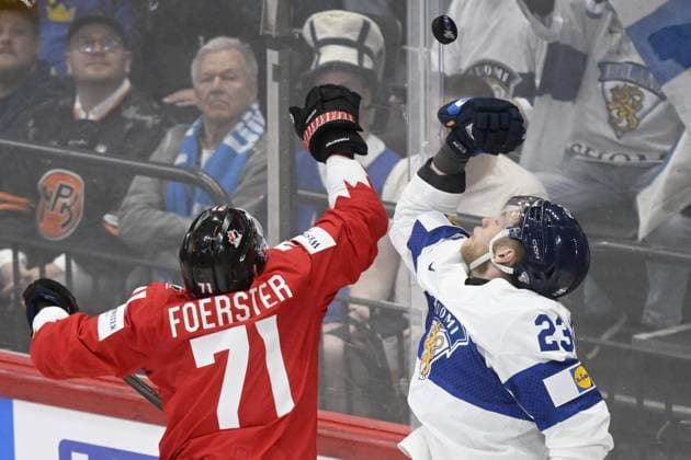 Tyson Foerster (L) of Canada and Nikolas Matinpalo of Finland vie during the 2025 IIHF Ice hockey, Eishockey World Championships preliminary round group A match between Canada and Finland in Stockholm on May 19, 2025. Stockholm Sweden LKFTJK20250519223057WGGD  Copyright: xVesaxMoilanenx LKFTJK20250519223057WGGD
