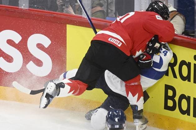 Brayden Schenn (L) of Canada tackles Hannes Björninen of Finland during the 2025 IIHF Ice hockey, Eishockey World Championships preliminary round group A match between Canada and Finland in Stockholm on May 19, 2025. Stockholm Sweden LKFTJK20250519223631RQHP  Copyright: xVesaxMoilanenx LKFTJK20250519223631RQHP