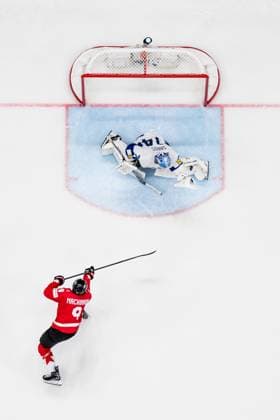 250519 Goaltender Juuse Saros of Finland with a save against Nathan MacKinnon of Canada in the shootout during the 2025 IIHF Ice Hockey World Championship group stage game between Canada and Finland on May 19, 2025 in Stockholm Photo Simon Hastegard BILDBYRAN kod SH SH0623 ishockey ice hockey ishockey vm 2025 vm 2025 iihf world championship kanada canada finland 10 bbeng  Copyright: SIMONxHASTEGARD BB250519SH053