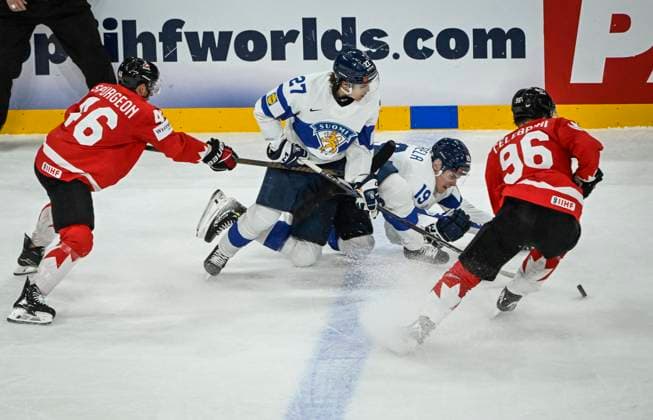 STOCKHOLM, SWEDEN 20250519 Canada s Jared Spurgeon 46 and Macklin Celebrini 96 fight for the puck with Finland s Mikael Pyyhtiä 27 and Waltteri Merela 19 during the IIHF Ice Hockey World Championship group A match between Canada and Finland at Avicii Arena in Stockholm, Sweden, on May 19, 2025 STOCKHOLM SWEDEN x10080x  Copyright: xFredrikxSandberg TTx ICE HOCKEY WC CANADA-FINLAND