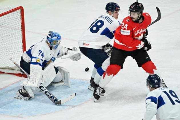 STOCKHOLM, SWEDEN 20250519 Canada s Phillip Danault against Finland s Vili Saarijarvi and Finland s goalkeeper Juuse Saros during the IIHF Ice Hockey World Championship group A match between Canada and Finland at Avicii Arena in Stockholm, Sweden, on May 19, 2025 STOCKHOLM SWEDEN x10080x  Copyright: xFredrikxSandberg TTx ICE HOCKEY WC CANADA-FINLAND