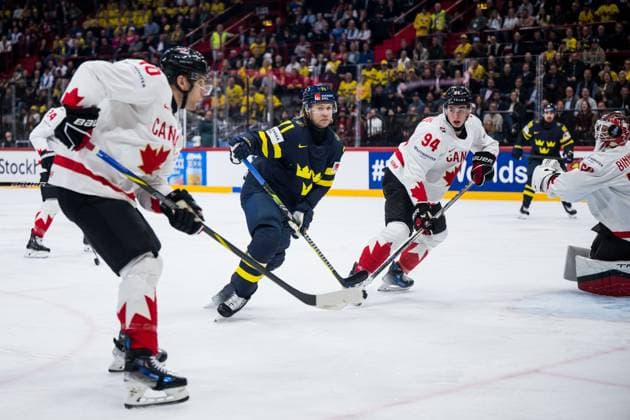 250520 William Karlsson of Sweden and Porter Martone of Canada during the 2025 IIHF Ice Hockey World Championship group stage game between Sweden and Canada on May 20, 2025 in Stockholm Photo Maxim Thore BILDBYRAN kod MT JM0689 ishockey, ice hockey,ishockey vm 2025, vm, 2025 iihf world champ  Copyright: MAXIMxTHORE BB250520MT066