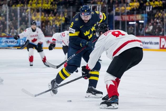 250520 Filip Forsberg of Sweden and Noah Dobson of Canada during the 2025 IIHF Ice Hockey World Championship group stage game between Sweden and Canada on May 20, 2025 in Stockholm Photo Maxim Thore BILDBYRAN kod MT JM0689 ishockey, ice hockey,ishockey vm 2025, vm, 2025 iihf world champ  Copyright: MAXIMxTHORE BB250520MT071