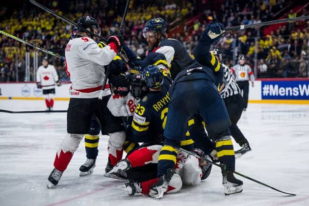 250520 Lucas Raymond and Jonas Brodin of Sweden in a fight with Sidney Crosby and Nathan MacKinnon of Canada during the 2025 IIHF Ice Hockey World Championship group stage game between Sweden and Canada on May 20, 2025 in Stockholm Photo Maxim Thore BILDBYRAN kod MT JM0689 ishockey ice hockey ishockey vm 2025 vm 2025 iihf world championship sverige sweden kanada canada bbeng gruppspel bbauto  Copyright: MAXIMxTHORE BB250520MT083