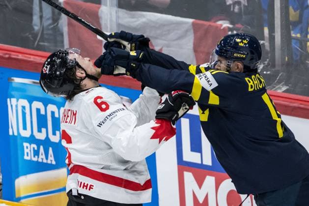 250520 Travis Sanheim of Canada and Mikael Backlund of Sweden during the 2025 IIHF Ice Hockey World Championship group stage game between Sweden and Canada on May 20, 2025 in Stockholm Photo Simon Hastegard BILDBYRAN kod SH JM0689 ishockey ice hockey ishockey vm 2025 vm 2025 iihf world championship sverige sweden kanada canada bbeng gruppspel  Copyright: SIMONxHASTEGARD BB250520SH028
