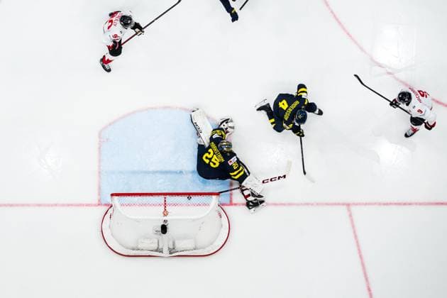 250504 Nathan MacKinnon of Canada scores 2 5 behind goaltender Jacob Markström and Rasmus Andersson of Sweden during the soccer match in Allsvenskan between Djurgarden and AIK on May 4, 2025 in Stockholm  Copyright: JOELxMARKLUND BB250504JM072