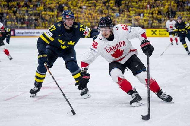 250520 Isac Lundeström of Sweden and Brandon Montour of Canada during the 2025 IIHF Ice Hockey World Championship group stage game between Sweden and Canada on May 20, 2025 in Stockholm Photo Joel Marklund BILDBYRAN kod JM JM0689 ishockey ice hockey ishockey vm 2025 vm 2025 iihf world championship sverige sweden kanada canada bbeng gruppspel  Copyright: JOELxMARKLUND BB250520JM062