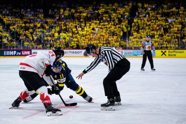 250520 Phillip Danault of Canada and Mikael Backlund of Sweden with a face off during the 2025 IIHF Ice Hockey World Championship group stage game between Sweden and Canada on May 20, 2025 in Stockholm Photo Joel Marklund BILDBYRAN kod JM JM0689 ishockey ice hockey ishockey vm 2025 vm 2025 iihf world championship sverige sweden kanada canada bbeng gruppspel  Copyright: JOELxMARKLUND BB250520JM098