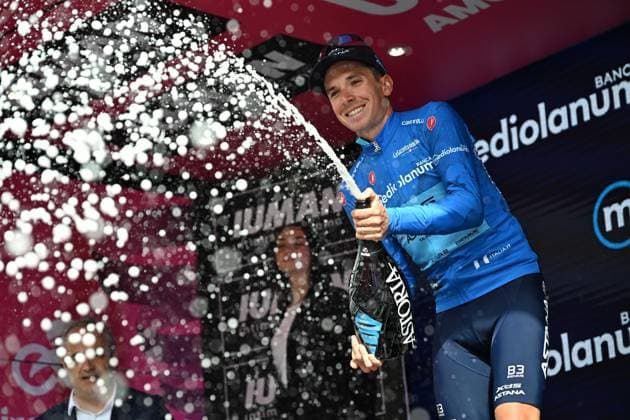 May 21, 2025, Castelnovo Ne Monti, ITALY: Italian rider Lorenzo Fortunato of XDS Astana Team retaining the best climber s blue jersey poses on the podium after 11th stage of the 108 Giro d Italia 2025, cycling race over 186 km from Viareggio to Castelnovo Ne Monti, Italy, 21 May 2025. ANSA LUCA ZENNARO. Giro D Italia Cycling Tour - Stage 11  - ZUMAa110 20250521_zaf_a110_027 Copyright: xLucaxZennarox