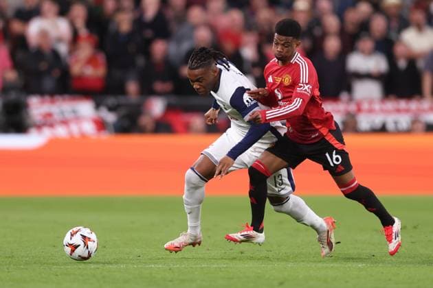 Bilbao, Spain, 21st May 2025. Destiny Udogie of Tottenham and Amad Diallo of Manchester United, ManU challenge for the ball during the Tottenham Hotspur vs Manchester United UEFA Europa League Final match at San Mames, Bilbao. Picture credit should read: David Klein Sportimage EDITORIAL USE ONLY. No use with unauthorised audio, video, data, fixture lists, club league logos or live services. Online in-match use limited to 120 images, no video emulation. No use in betting, games or single club league player publications. SPI_065_DK_Tottenham_Man_Utd SPI-3943-0065