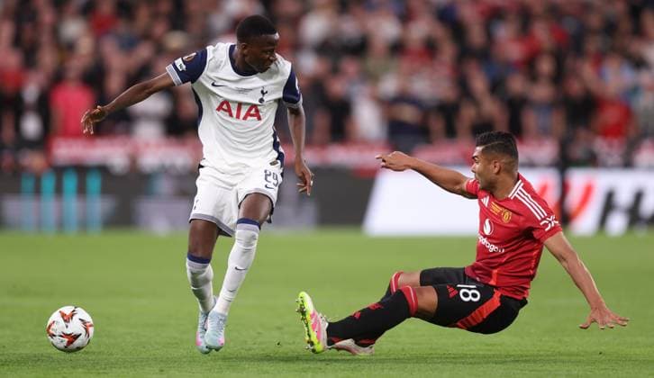 Bilbao, Spain, 21st May 2025. Pape Matar Sarr of Tottenham and Casemiro of Manchester United, ManU challenge for the ball during the Tottenham Hotspur vs Manchester United UEFA Europa League Final match at San Mames, Bilbao. Picture credit should read: David Klein Sportimage EDITORIAL USE ONLY. No use with unauthorised audio, video, data, fixture lists, club league logos or live services. Online in-match use limited to 120 images, no video emulation. No use in betting, games or single club league player publications. SPI_075_DK_Tottenham_Man_Utd SPI-3943-0075