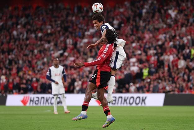 Bilbao, Spain, 21st May 2025. Patrick Dorgu of Manchester United, ManU and Brennan Johnson of Tottenham challenge for the ball during the Tottenham Hotspur vs Manchester United UEFA Europa League Final match at San Mames, Bilbao. Picture credit should read: David Klein Sportimage EDITORIAL USE ONLY. No use with unauthorised audio, video, data, fixture lists, club league logos or live services. Online in-match use limited to 120 images, no video emulation. No use in betting, games or single club league player publications. SPI_080_DK_Tottenham_Man_Utd SPI-3943-0080