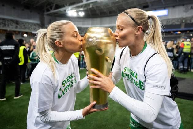 250521 Hammarbys Lotta Ökvist and Stina Lennartsson cheer with the trophy after the final of the Swedish Cup between Hammarby and IFK Norrköping on May 21, 2025 in Stockholm  Copyright: MAXIMxTHORE BB250521MT122