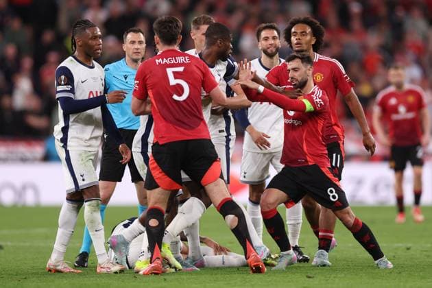 Bilbao, Spain, 21st May 2025. Bruno Fernandes of Manchester United, ManU looks to hold back Kevin Danso of Tottenham and clashing with Joshua Zirkzee of Manchester United during the Tottenham Hotspur vs Manchester United UEFA Europa League Final match at San Mames, Bilbao. Picture credit should read: David Klein Sportimage EDITORIAL USE ONLY. No use with unauthorised audio, video, data, fixture lists, club league logos or live services. Online in-match use limited to 120 images, no video emulation. No use in betting, games or single club league player publications. SPI_156_DK_Tottenham_Man_Utd SPI-3943-0159