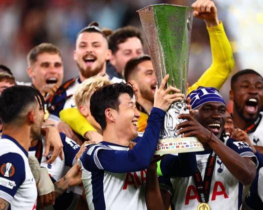 Son Heung-Min of Tottenham Hotspur, Yves Bissouma of Tottenham Hotspur and team mates lift the UEFA Europa League Trophy Tottenham Hotspur v Manchester United, ManU Europa League Final, Football, San Mames Stadium, Bilbao, Spain - 21 May 2025 EDITORIAL USE ONLY No use with unauthorised audio, video, data, fixture lists, club league logos or live services. Online in-match use limited to 120 images, no video emulation. No use in betting, games or single club league player publications. Copyright: xJamesxMarsh Shutterstockx 15312890ey