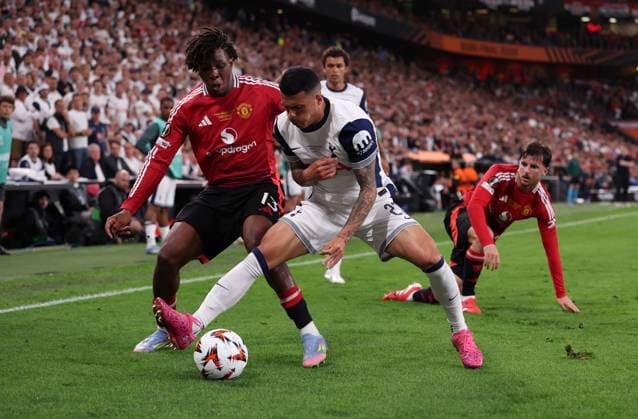 Bilbao, Spain, 21st May 2025. Patrick Dorgu of Manchester United, ManU and Pedro Porro of Tottenham challenge for the ball during the Tottenham Hotspur vs Manchester United UEFA Europa League Final match at San Mames, Bilbao. Picture credit should read: David Klein Sportimage EDITORIAL USE ONLY. No use with unauthorised audio, video, data, fixture lists, club league logos or live services. Online in-match use limited to 120 images, no video emulation. No use in betting, games or single club league player publications. SPI_270_DK_Tottenham_Man_Utd SPI-3943-0274