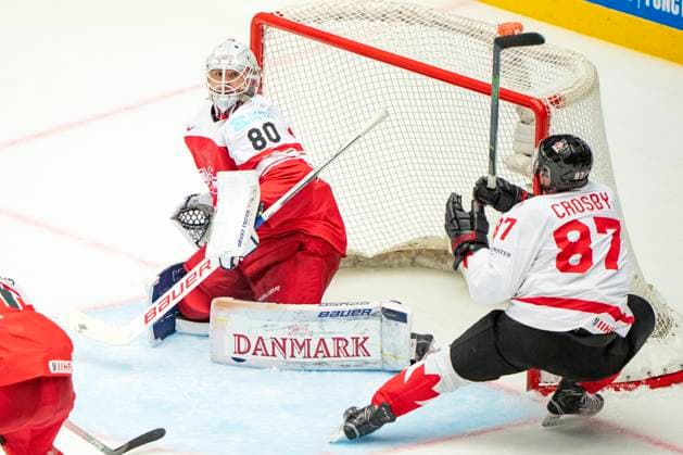 Denmark IIHF Hockey Worlds Canada vs Denmark Sidney Crosby, Canada, right, challenges goalkeeper Frederik Dichow, Denmark during the quarter final match between Canada and Denmark at the IIHF Ice Hockey World Championships in Herning, Denmark, Thursday May 22, 2025 , Herning Denmark Mors  Copyright: BoxAmrstrupx xRitzauxScanpix BoxAmstrupx spdk20250522-215600-L
