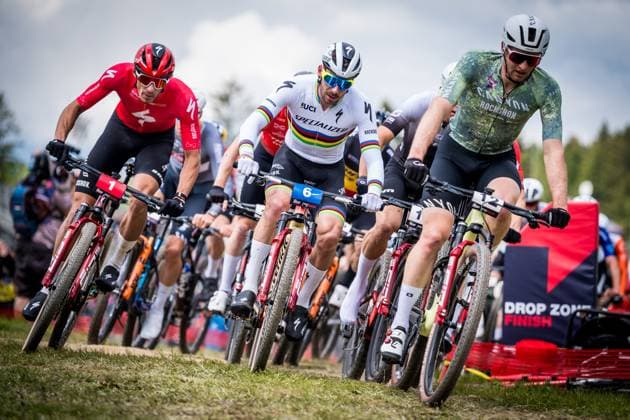 From left Christopher Blevins of USA, Victor Koretzky of France, Luca Schwarzbauer of Germany compete during the short track during the Mountain bike cross country World Cup event, Nove Mesto na Morave, Czech Republic, May 24, 2025. (CTKxPhoto JaroslavxSvoboda) CTKPhotoP2025052402530  CTKPhotoP2025052402530