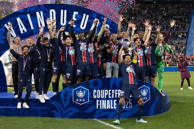 Saint Denis, France, May 24, 2025 - Paris Saint Germain s Brazilian defender 05 Marquinhos raises the trophy as he celebrates with teammates after winning French Cup final football match between Paris Saint Germain (PSG) and Stade de Reims at the Stade de France.  Copyright: xAlexisxSciardx