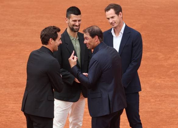 British Andy Murray (R), Swiss Roger Federer (L) and Czech Novak Djokovic (2L), congratulate Rafael Nadal of Spain during a tribute ceremony in his honor, on the first day of the Roland Garros French Tennis Open in Paris, France, on Sunday, May 25, 2025. Nadal was honored in a special farewell ceremony that celebrated his extraordinary legacy in Paris.  PAR20250525122 MAYAxVIDON-WHITE